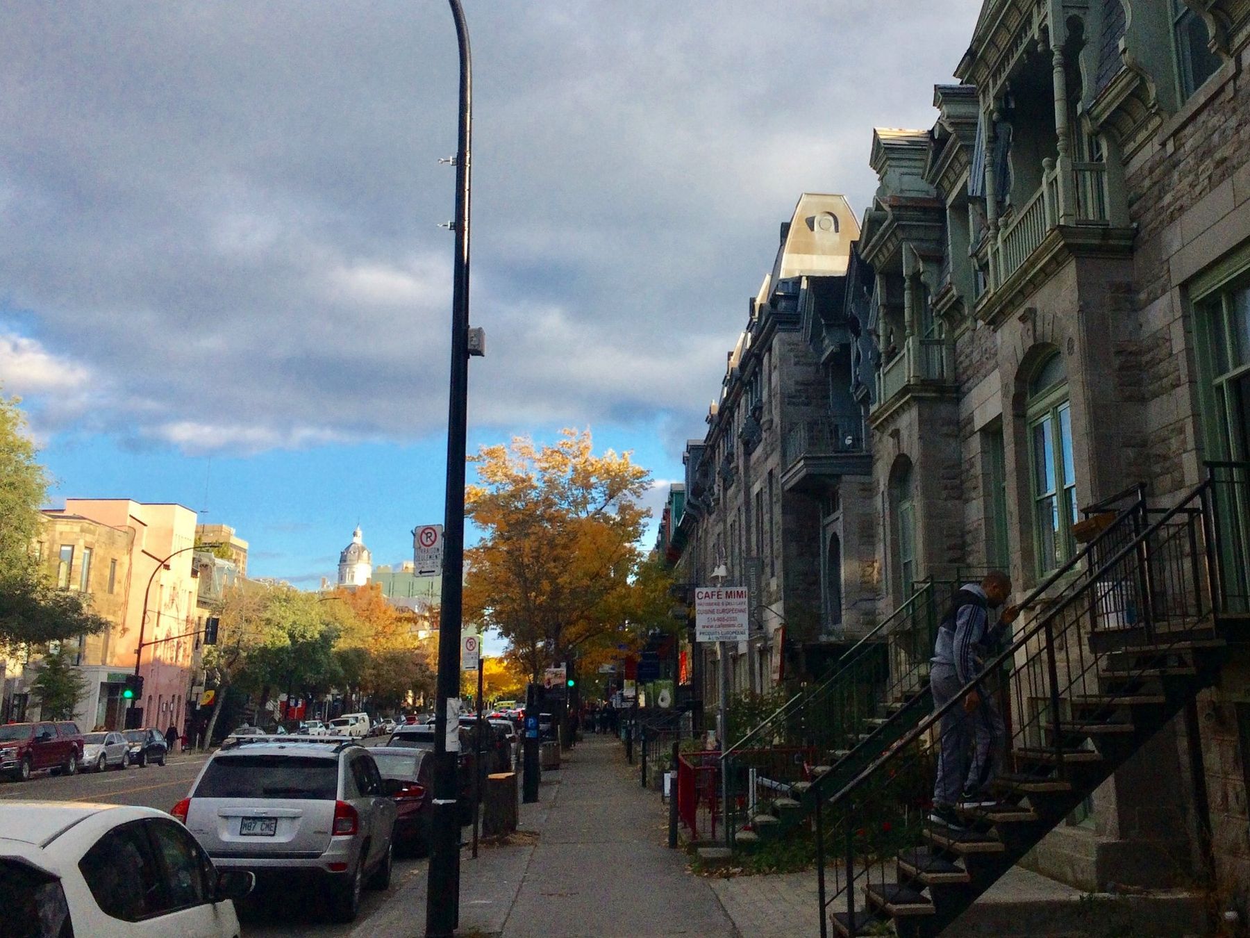 Greystone plexes with exterior staircases on a Plateau-Mont-Royal street